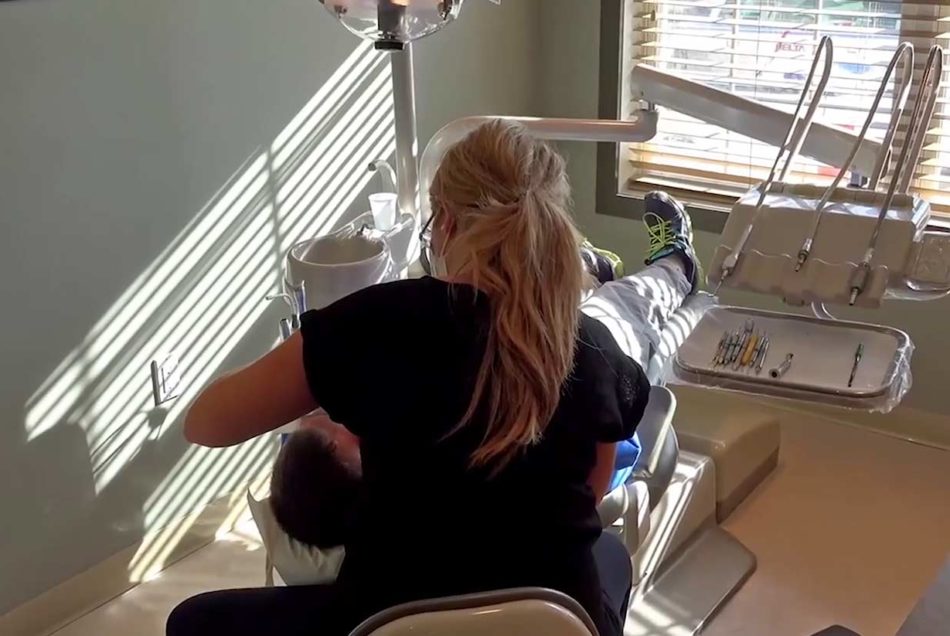 Hygienist Cleaning Patients Teeth