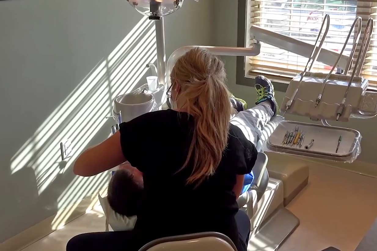 Hygienist Cleaning Patients Teeth | Welcome Smile Dental | Calgary Downtown Dentistry