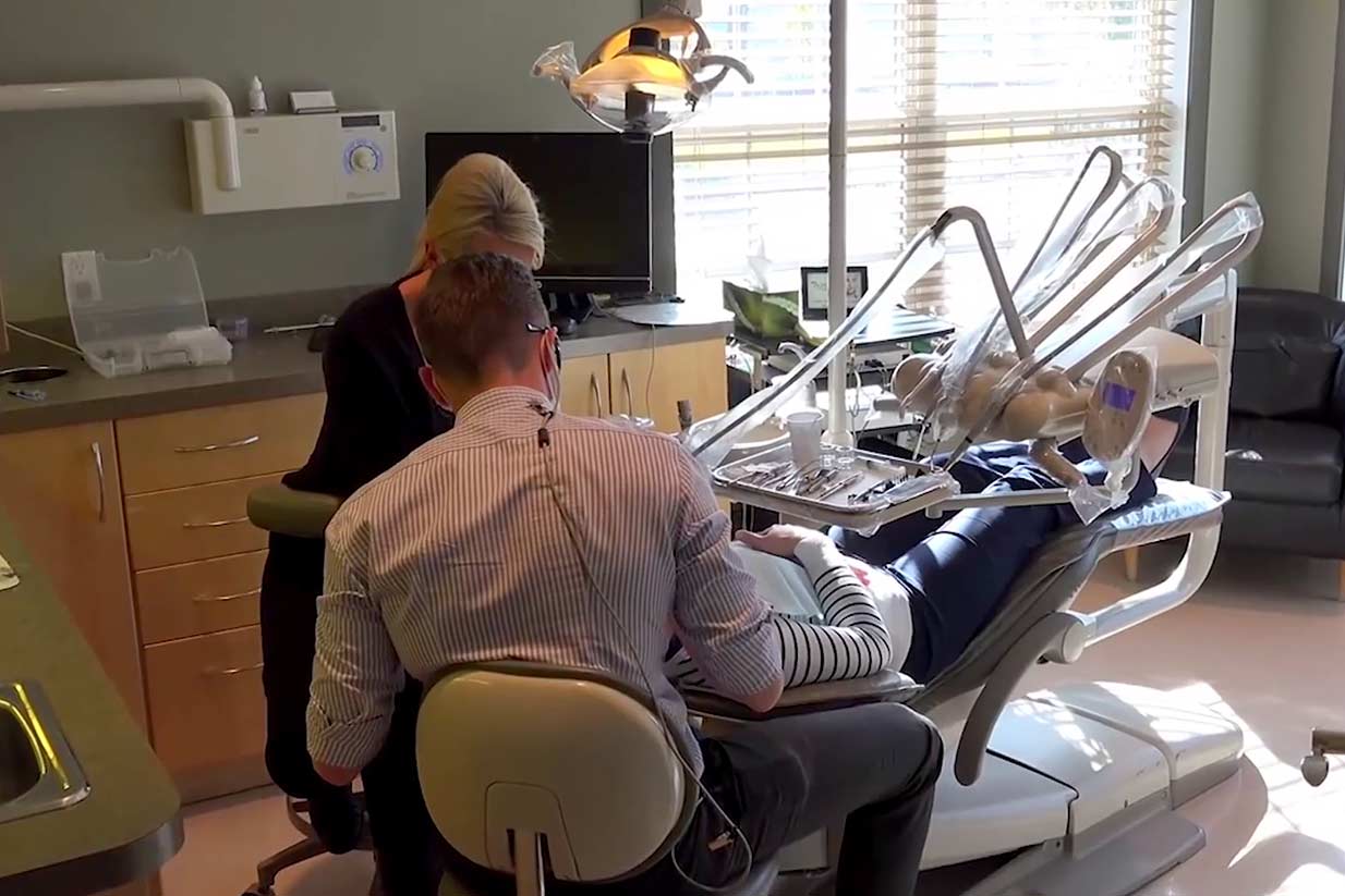 Dr. Kellen Smith working on patient | Welcome Smile Dental | Calgary Downtown Dentist